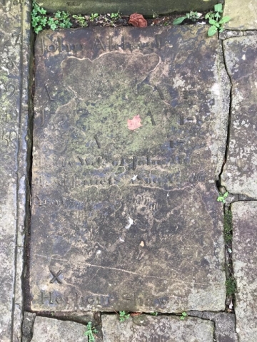 The cemetery was badly damaged during bombing in WWII.  This tombstone is now used as a paver at the back of the church.